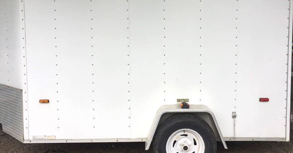 White enclosed bike trailer